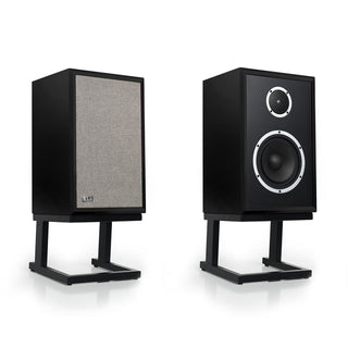 Two black L-Acoustic studio speakers on matching black stands, shown from front and side angles against a clean white background.
