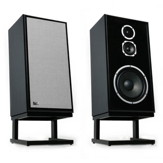 Two black bookshelf speakers on stands, one showing the front grille and the other showing the front face with two drivers, on a white background.