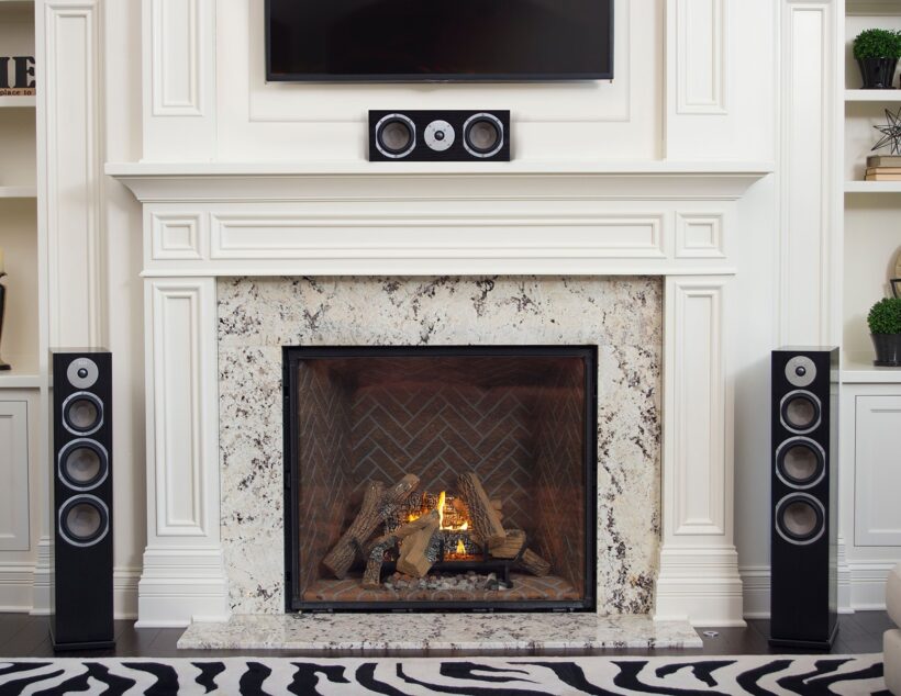 Kendall floor standing speakers by fireplace